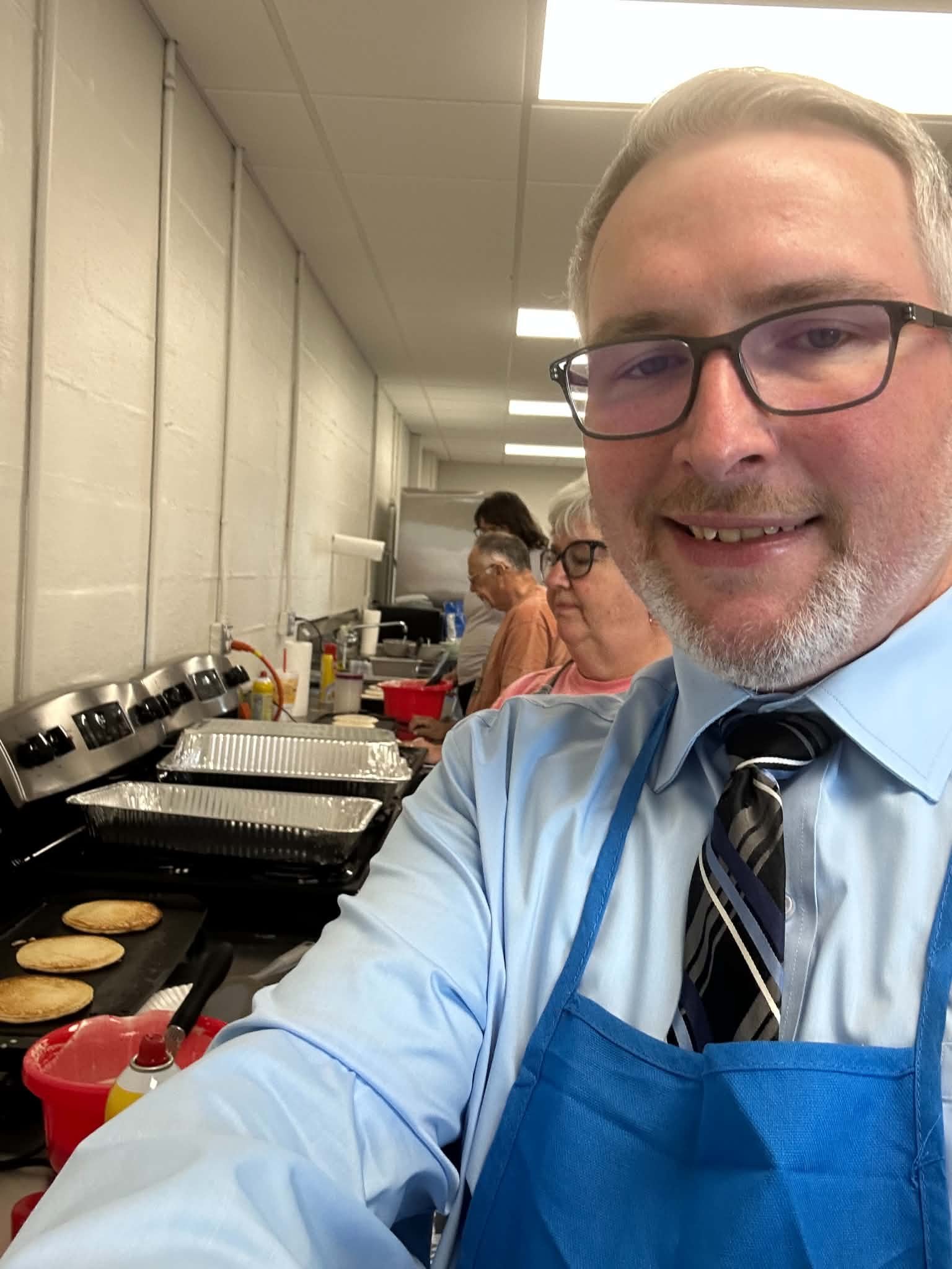 Michael Mosteller serving pancakes at a pancake breakfast in Putnam County